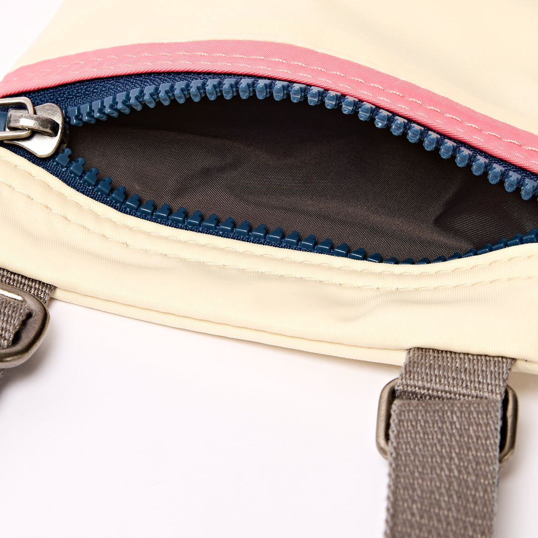 Chelsea Pocket Sling Bag in Wax Paper Stripe