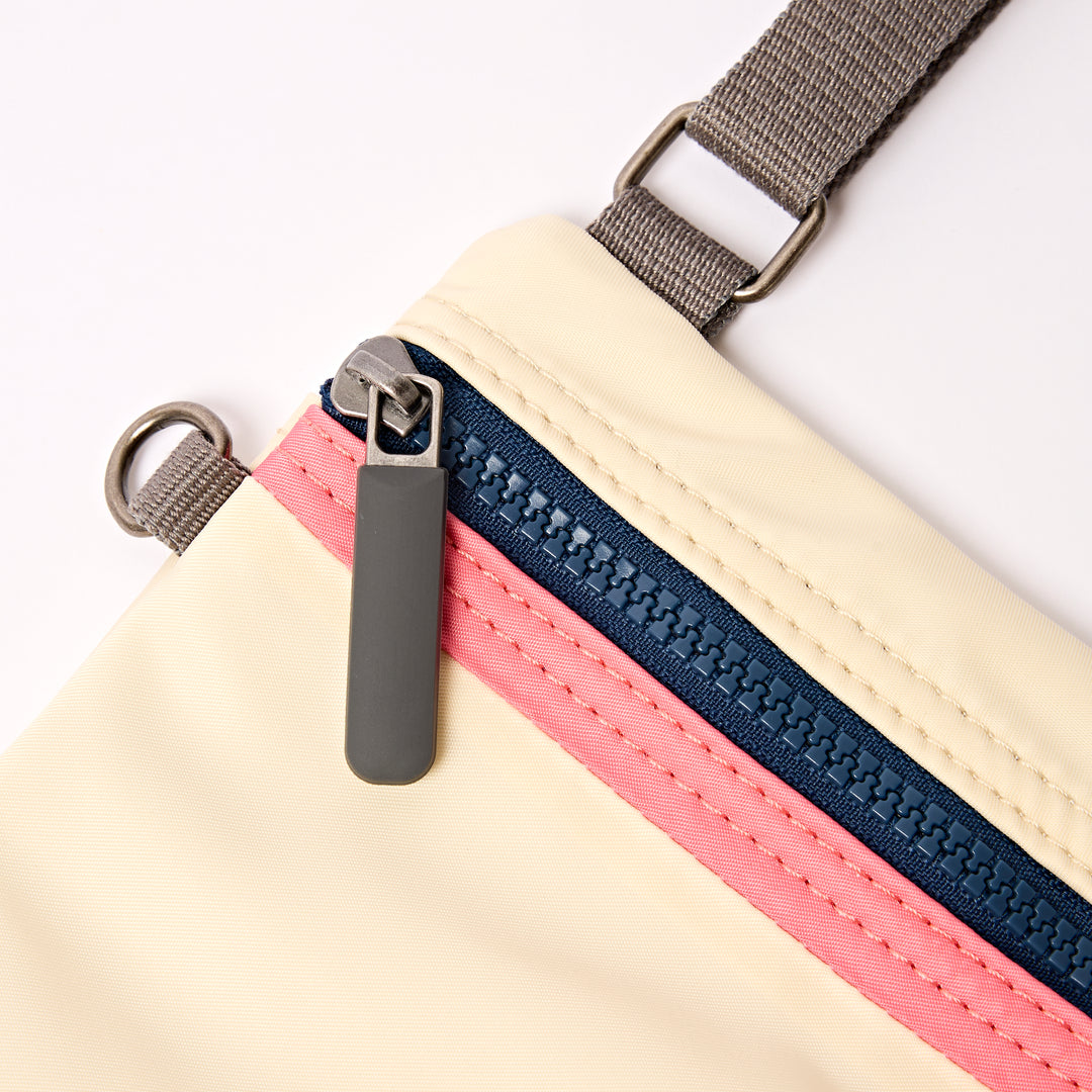 Chelsea Pocket Sling Bag in Wax Paper Stripe