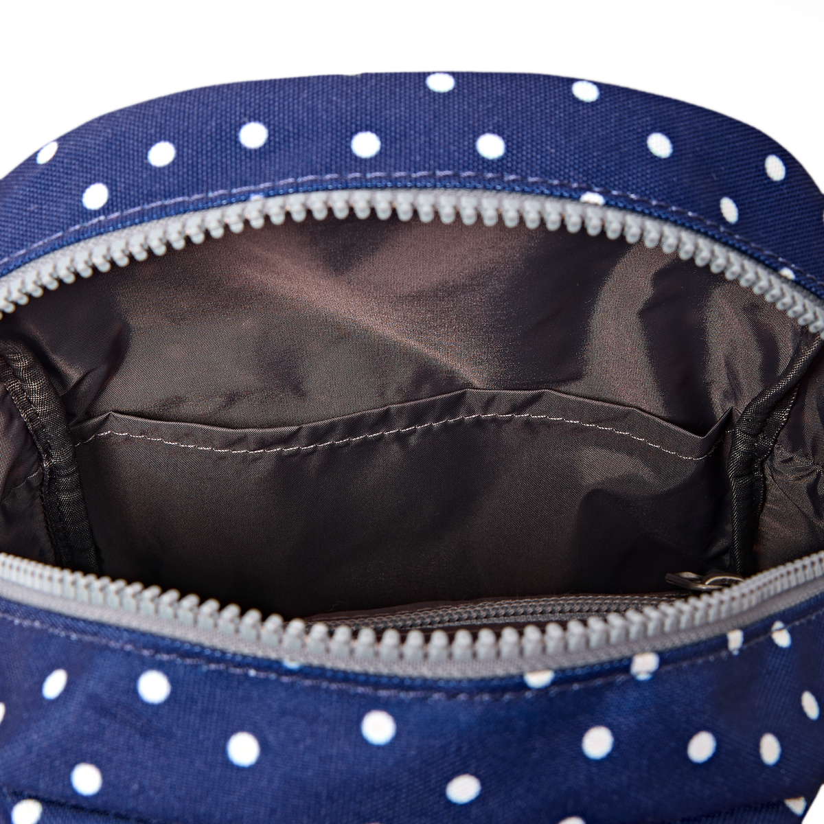 Willesden Sling Bag in Navy Polka Dot